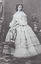 1860 Empress Elisabeth standing behind a chair in her flounced dress
