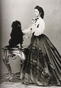 1864 Empress Elizabeth playing with a dog