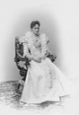 1898 Wider view of seated Empress Alexandra Feodorovna in dress with spyglass sleeves by ? From Tatiana Z half