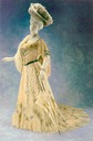 1900 Worth dinner gown machine alençon lace over white satin with Venetian glass beads irridescent pailletes in blue