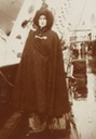 1908 Alexandra wearing a rain slicker