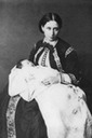 1864 Alice wearing a zouave jacket holding Elisabeth ("Ella")