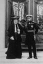 Duke and Duchess of Connaught, standing on steps before elaborate doors