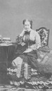 Eugénie seated with lace shawl on her lap