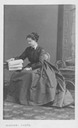 Maria Pia seated reading