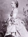 Princess Helena wearing a bustle carrying a parasol