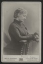 Former Empress Eugenie seated in day dress by W. & D. Downey